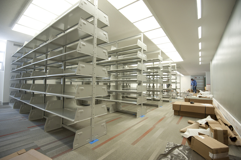 With carpet and lighting completed, new book shelves have been installed.