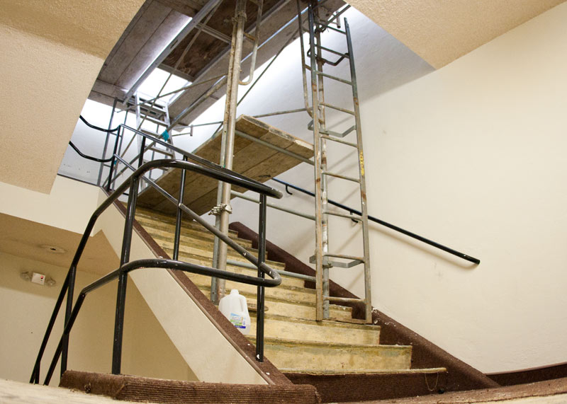 Scaffolding blocks off the library’s Penthouse floor as crews replace the building’s uppermost bank of windows to maximize natural lighting.