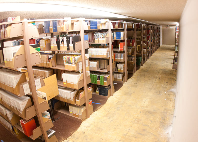 The book stacks on the upper and lower floors are still mostly intact as crews work around them.